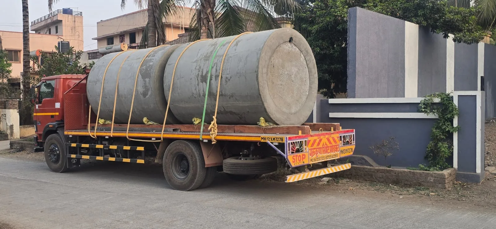 Truck delivering precast septic tanks for Gurukrupa Enterprises