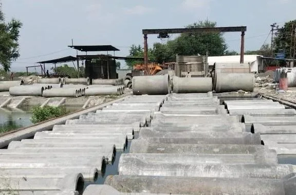 Gurukrupa Enterprises manufacturing yard with pipe molds and gantry crane